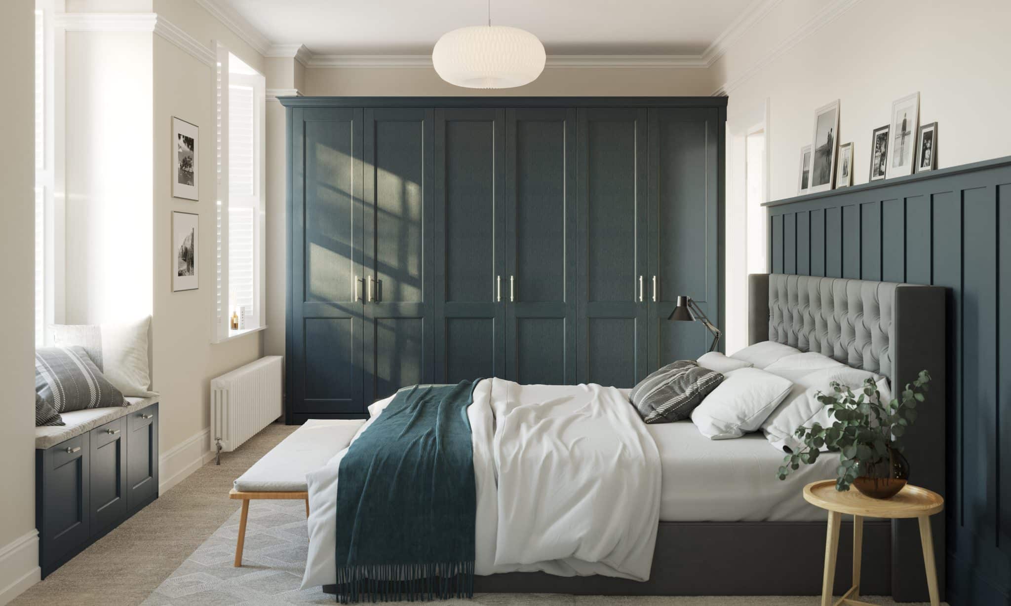 Dark blue bedroom with panelling and cabinets