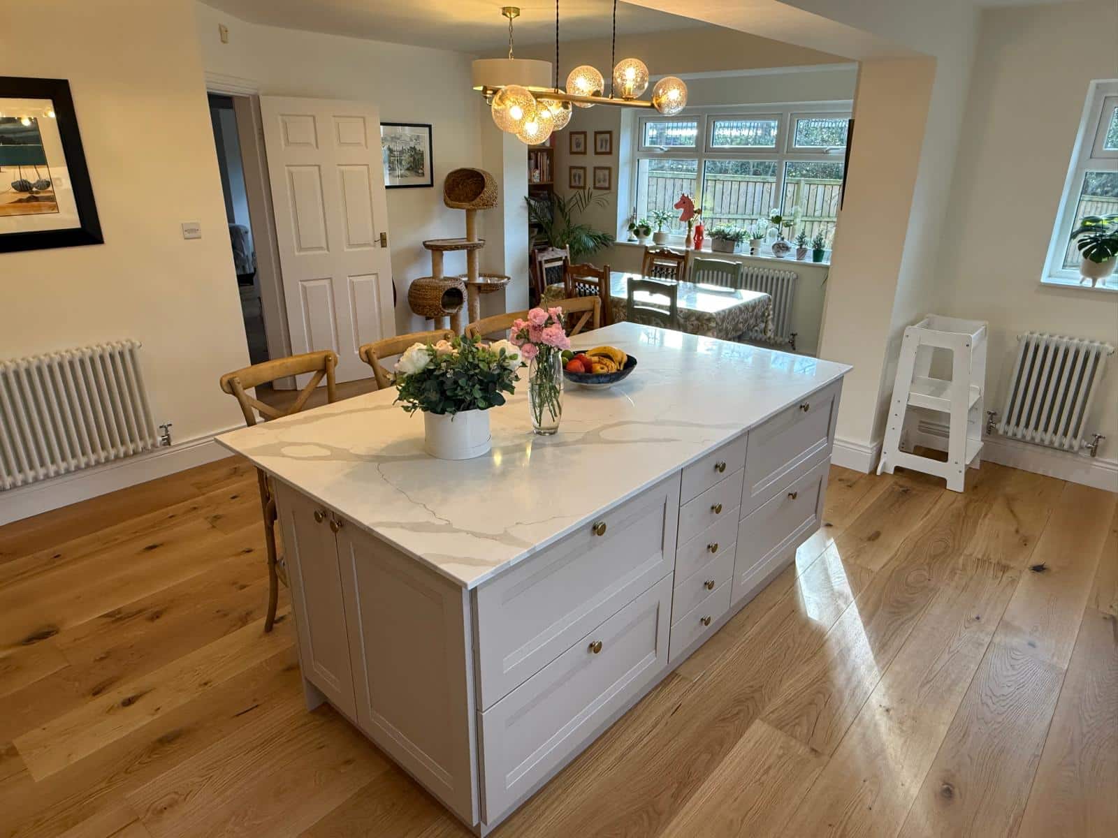 Mcgown 5 Shaker kitchen in Cashmere with quartz island, oak flooring and floor to ceiling cupboards fitted by Dragonville Interiors in Durham