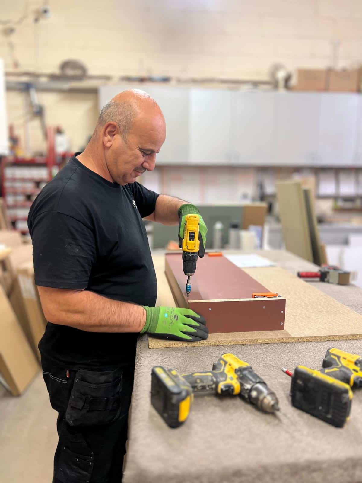 Manufacturing team creating fitted furniture for Dragonville Interiors projects